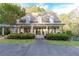 Beautiful home exterior featuring a spacious porch, manicured landscaping, and a long driveway at 3380 Hill Forest Nw Trl, Acworth, GA 30101