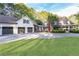 Stunning exterior shot of the house, highlighting the driveway and three-car garage at 3380 Hill Forest Nw Trl, Acworth, GA 30101