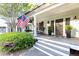 Inviting covered porch with rocking chairs and swing, perfect for outdoor relaxation at 3380 Hill Forest Nw Trl, Acworth, GA 30101
