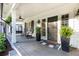 Welcoming front porch with rocking chairs, lush plants, and classic design elements at 3380 Hill Forest Nw Trl, Acworth, GA 30101