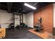 Basement gym area featuring weight training equipment and a vintage wood burning stove at 3380 Hill Forest Nw Trl, Acworth, GA 30101