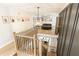 Bright hallway featuring modern chandelier lighting and an overlook to a dining area at 3380 Hill Forest Nw Trl, Acworth, GA 30101