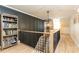 Stylish hallway with wainscoting, hardwood floors, and modern light fixture leading to the second floor at 3380 Hill Forest Nw Trl, Acworth, GA 30101
