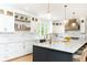 Spacious kitchen features a large island, pendant lighting, and stainless steel appliances at 3380 Hill Forest Nw Trl, Acworth, GA 30101
