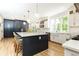Open kitchen features a large island with seating and stainless steel appliances at 3380 Hill Forest Nw Trl, Acworth, GA 30101