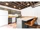 Basement kitchenette featuring ample counter space and seating, ideal for entertaining at 3380 Hill Forest Nw Trl, Acworth, GA 30101