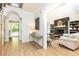 Open-concept living room adjacent to the entry with stylish furnishings and hardwood flooring at 3380 Hill Forest Nw Trl, Acworth, GA 30101