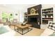 Cozy living room with built in shelves, fireplace, and natural light at 3380 Hill Forest Nw Trl, Acworth, GA 30101