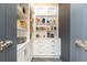 Pantry featuring built-in white shelving, drawers, and stainless steel hardware at 3380 Hill Forest Nw Trl, Acworth, GA 30101