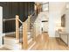 Bright foyer features a wooden staircase with iron balusters and open floor plan at 3380 Hill Forest Nw Trl, Acworth, GA 30101