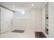 Basement storage area with neutral vinyl flooring and white cabinets at 8145 Stone Hill Rd, Cumming, GA 30028