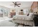 Comfortable main bedroom featuring fireplace, private balcony, and wall paneling at 8145 Stone Hill Rd, Cumming, GA 30028
