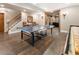 Recreation room features a pool table, hardwood floors, and a staircase leading to the upper level at 1273 Promontory Ln, Marietta, GA 30062