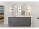 Elegant bathroom with dual vanity, white countertops, gray cabinets, and decorative mirrors with sconces at 1273 Promontory Ln, Marietta, GA 30062