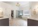 Luxurious primary bathroom featuring tiled floors, dual vanities, walk-in shower, and soaking tub at 1273 Promontory Ln, Marietta, GA 30062