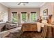 Cozy bedroom with a comfortable bed, decorative rug, and natural light streaming through the windows at 1273 Promontory Ln, Marietta, GA 30062