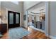 Open foyer with hardwood floors, complemented by an elegant dining room with tray ceilings and stylish lighting at 1273 Promontory Ln, Marietta, GA 30062