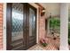 Elegant double front doors with glass panels, leading to a welcoming front porch with comfortable seating at 1273 Promontory Ln, Marietta, GA 30062