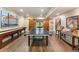 Game room equipped with a shuffleboard and ping pong table, with stylish decor, on hardwood floor at 1273 Promontory Ln, Marietta, GA 30062