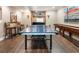 Game room features a ping pong table, stylish decor, and a glimpse into the home theater at 1273 Promontory Ln, Marietta, GA 30062