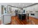 Spacious kitchen featuring an island with marble countertop, stainless steel appliances and white cabinets at 1273 Promontory Ln, Marietta, GA 30062