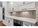 Kitchen featuring white cabinets, stainless steel appliances and subway tile backsplash at 1273 Promontory Ln, Marietta, GA 30062