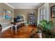 Well-lit home office with hardwood floors, large window, and built-in bookshelves, ideal for productivity at 1273 Promontory Ln, Marietta, GA 30062