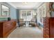 Serene sitting room with ample natural light from windows, wooden dressers, and two chairs for relaxing at 1273 Promontory Ln, Marietta, GA 30062