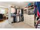 Spacious walk-in closet with custom shelving, drawers, and hanging space with access to a study at 1273 Promontory Ln, Marietta, GA 30062