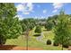 The meticulously maintained lawn and walking path provide a serene escape in this beautiful backyard at 4004 Edgecomb Dr, Roswell, GA 30075