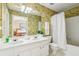 A double vanity bathroom with tub and shower that offers a clean and functional design at 4004 Edgecomb Dr, Roswell, GA 30075
