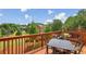 This inviting deck has a dining table and overlooks the verdant backyard, perfect for outdoor gatherings at 4004 Edgecomb Dr, Roswell, GA 30075