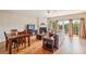 Bright living room with hardwood floors, fireplace, and sliding doors to outdoor balcony at 4004 Edgecomb Dr, Roswell, GA 30075