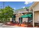 Exterior view of Starbucks with outdoor seating and ample parking at 4004 Edgecomb Dr, Roswell, GA 30075