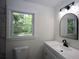 Bathroom with modern vanity and decorative mirror at 443 Indian Hills Dr, Dallas, GA 30157