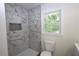 Bathroom features shower with marble-style tile at 443 Indian Hills Dr, Dallas, GA 30157