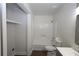Bathroom features a tub, toilet, vanity, and a closet at 443 Indian Hills Dr, Dallas, GA 30157