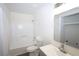 Bathroom with white fixtures, tub, and shower at 443 Indian Hills Dr, Dallas, GA 30157