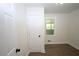 A bright bedroom with wood look floors, white walls and white trim at 443 Indian Hills Dr, Dallas, GA 30157