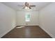 Sunlit bedroom with ceiling fan and hardwood floors at 443 Indian Hills Dr, Dallas, GA 30157