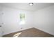 Bright bedroom with hardwood floors and a window at 443 Indian Hills Dr, Dallas, GA 30157