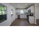 A bright kitchen featuring white cabinets, stainless steel appliances, and granite countertops at 443 Indian Hills Dr, Dallas, GA 30157