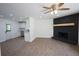 An open floor plan with a fireplace and wood-look floors and recessed lighting at 443 Indian Hills Dr, Dallas, GA 30157