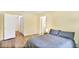 Bedroom featuring hardwood floors, closet access, and lots of natural light at 8740 Roswell Rd # 9C, Atlanta, GA 30350