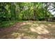 The expansive backyard boasts privacy and mature trees at 1034 Hillsborough Nw, Kennesaw, GA 30144