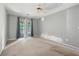 Light-filled bedroom with a ceiling fan and neutral carpeting at 1034 Hillsborough Nw, Kennesaw, GA 30144