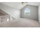 Upstairs bonus room with high ceiling and large arched window at 1034 Hillsborough Nw, Kennesaw, GA 30144