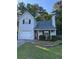 Charming two-story home with a front yard, driveway, and attached garage at 1034 Hillsborough Nw, Kennesaw, GA 30144