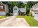 A charming home featuring a manicured lawn and an inviting front entrance at 1034 Hillsborough Nw, Kennesaw, GA 30144