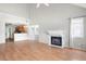 Spacious living room featuring hardwood floors, a fireplace, and plenty of natural light at 1034 Hillsborough Nw, Kennesaw, GA 30144